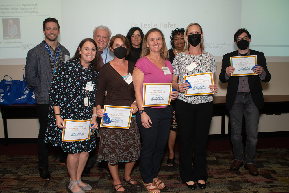 SPC celebrated presenters with group of students and support faculty with awards