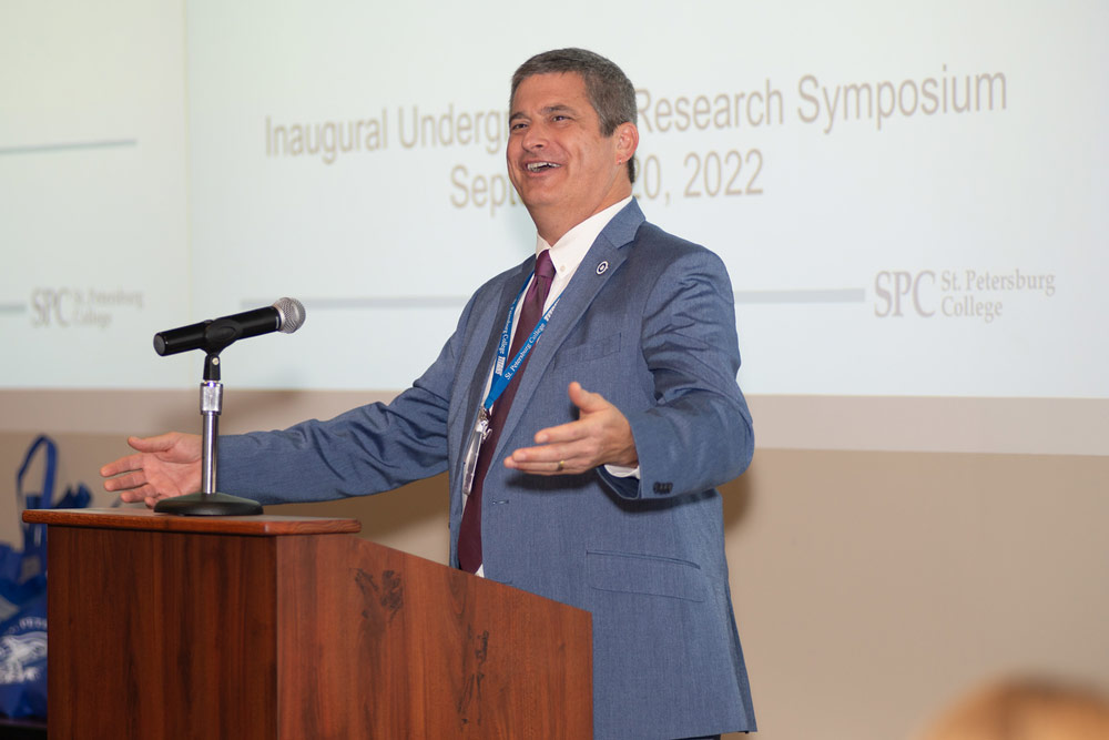 man at podium speaking